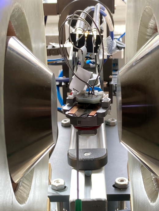 The photo shows spintronic devices built in a laboratory. Magnets, bought with the IERU project money, are used to study the devices.