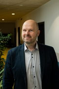 The photo shows AGH UST Professor Marcin Niemiec in the building of the Faculty of Computer Science, Electronics, and Telecommunications.